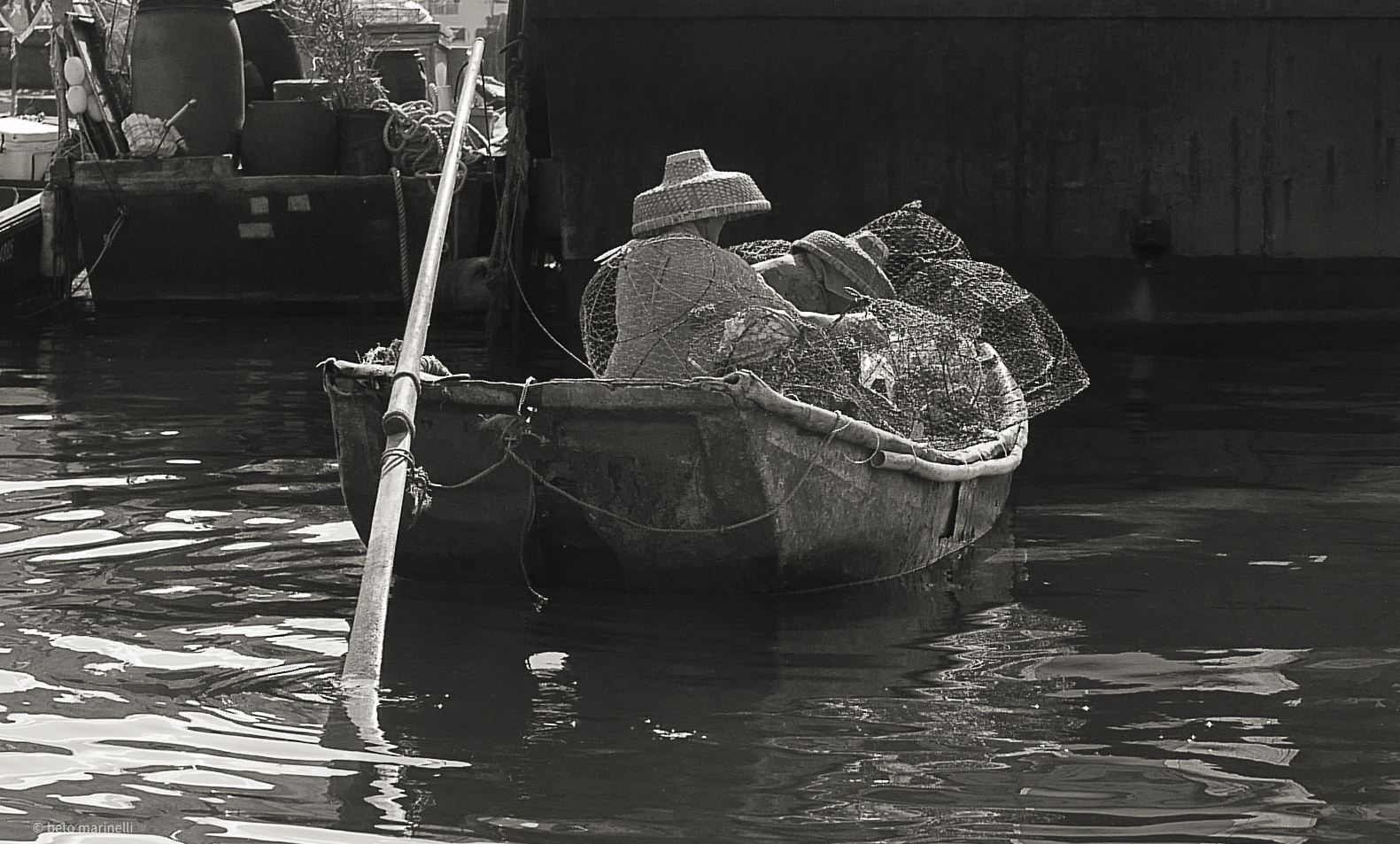 Black-and-white photograph of a wooden boat at rest — Print Lab decoration